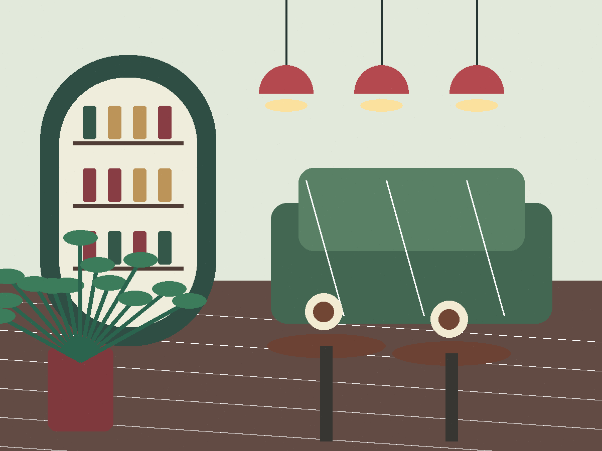 植物とソファ席がある落ち着いたカフェ店内
